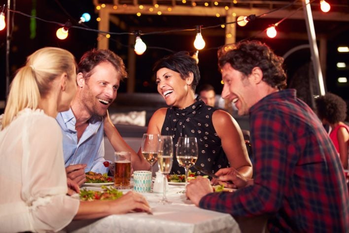 Friends Enjoying Dining at a Restaurant