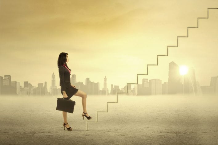 Woman Climbing Ranks