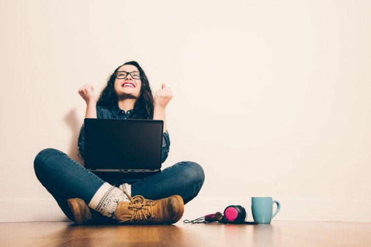 Excited Girl on Her Laptop Excited Girl on Her Laptop