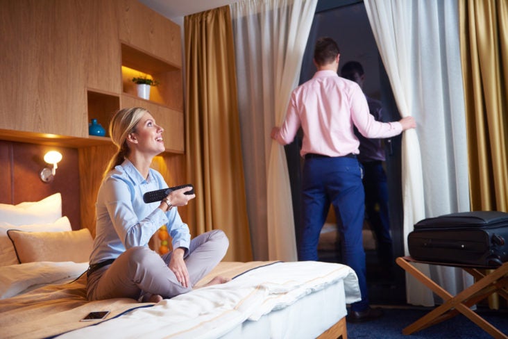 relaxed and happy young couple in modern hotel room relaxed and happy young couple in modern hotel room