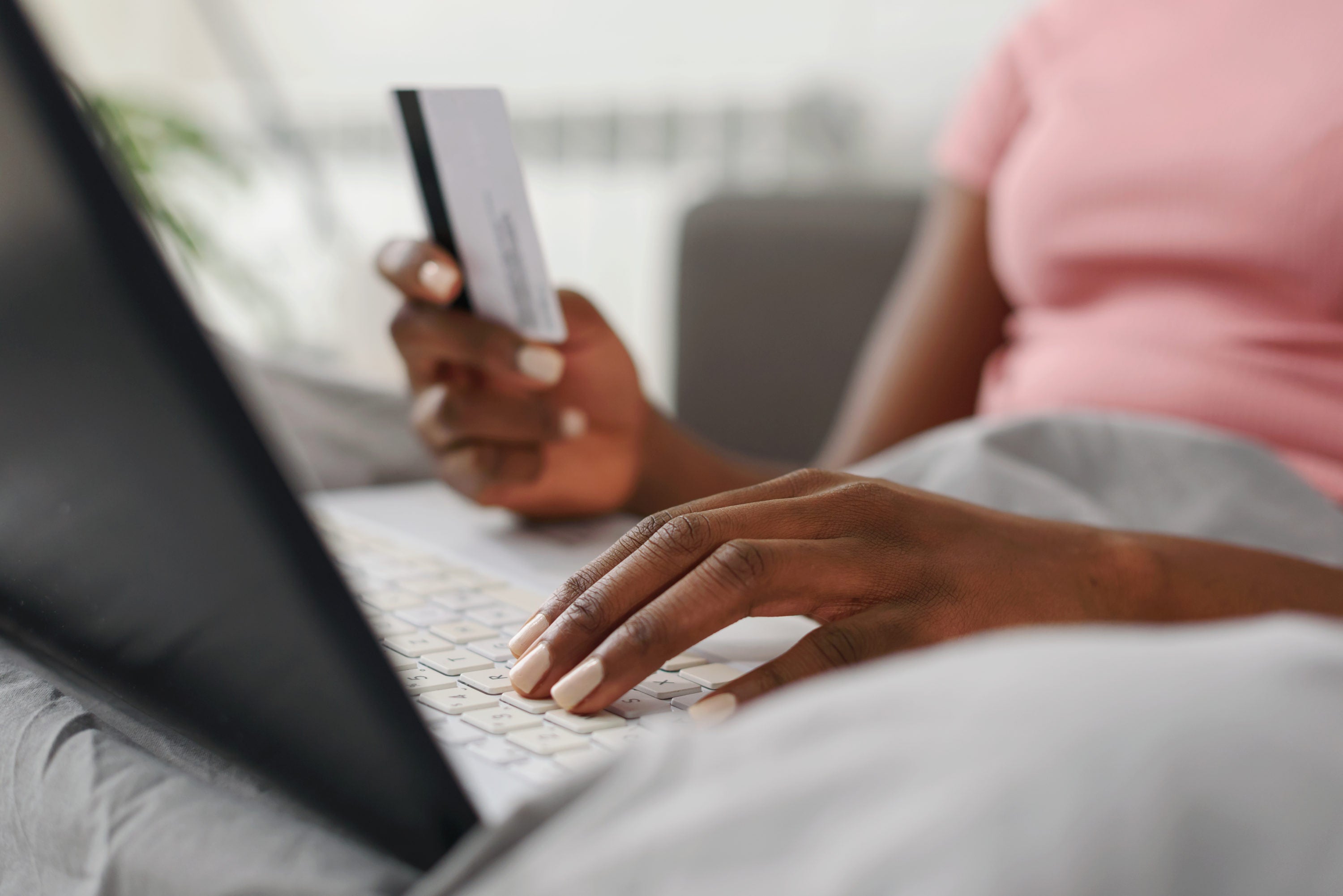 Woman using card to shop online