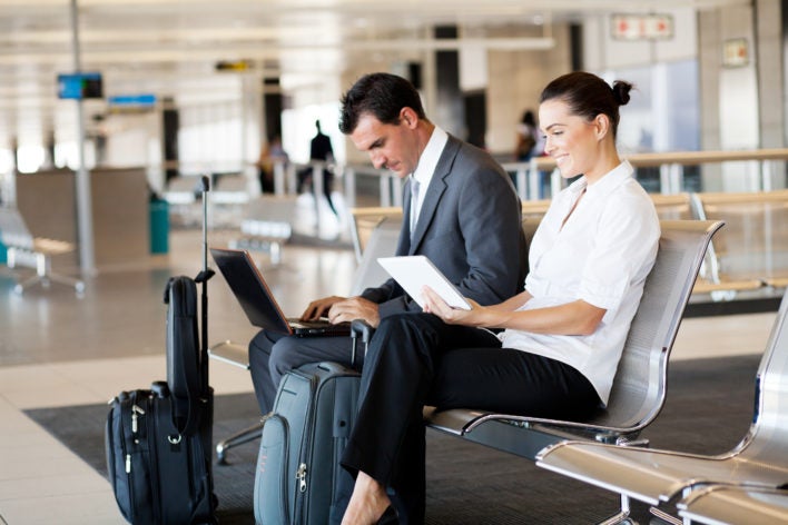 airport laptop couple