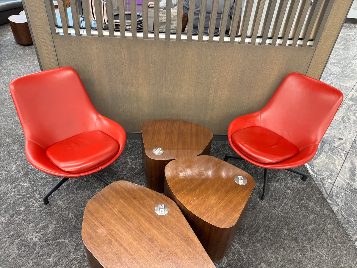 Air Canada Maple Leaf Lounge LGA seating with powered wooden tables