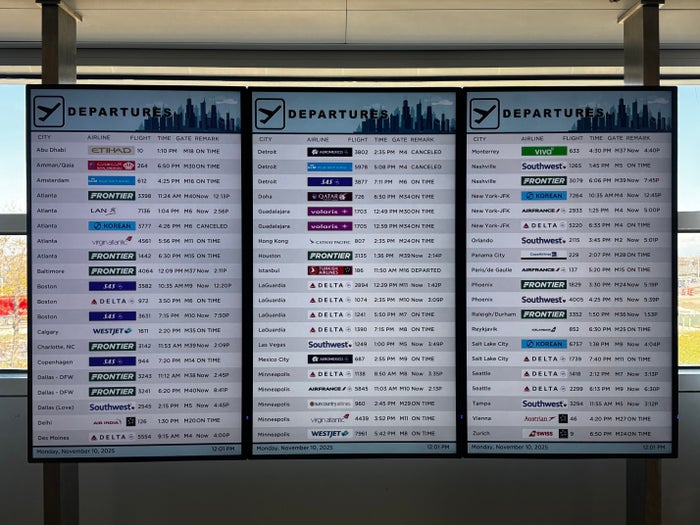 Airport departures board Chicago O’Hare ORD Airport departures board Chicago O'Hare ORD