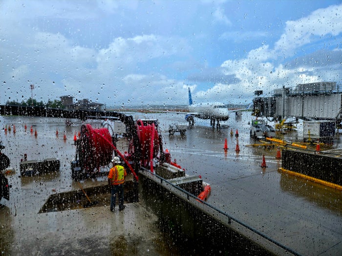 Couple sitting on dock Airport weather delay