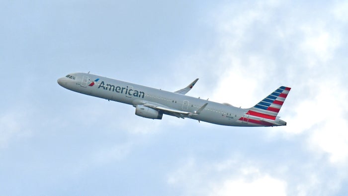 An airplane in the colors of American Airlines taking off