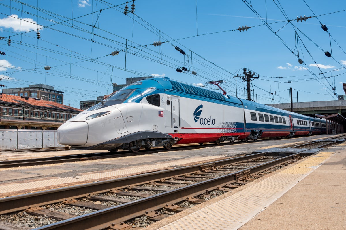 Amtrak NextGen Acela train under bridge