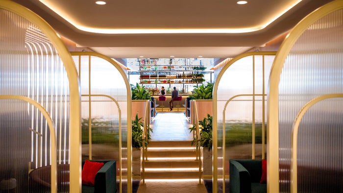 British Airways New Miami Lounge view up steps to bar