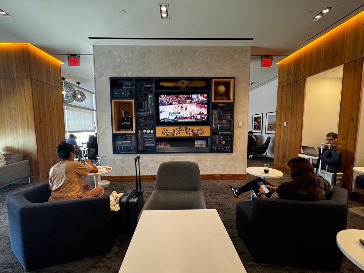 Centurion Lounge Las Vegas TV wall with seats