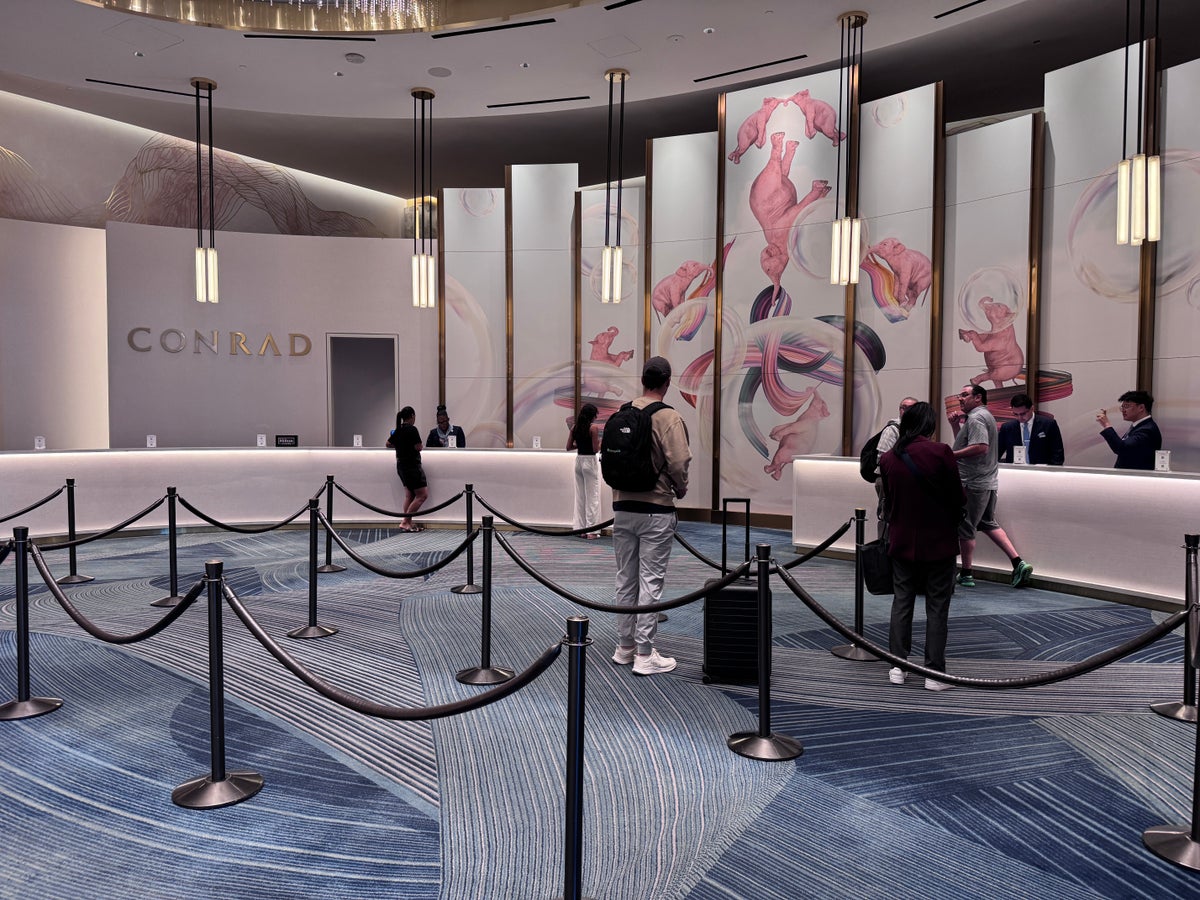 Conrad Las Vegas check in front desk lobby with guests