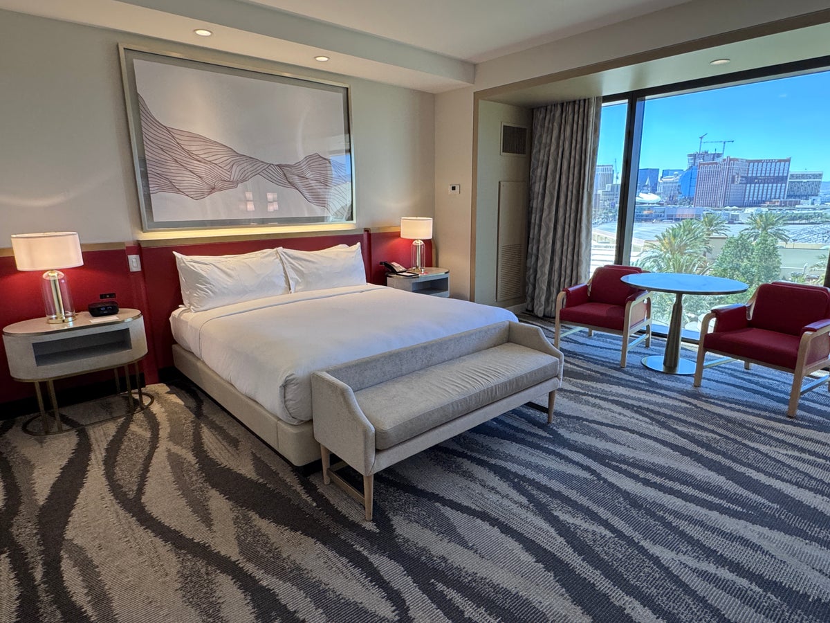 Conrad Las Vegas king room bed with Strip view and seating area