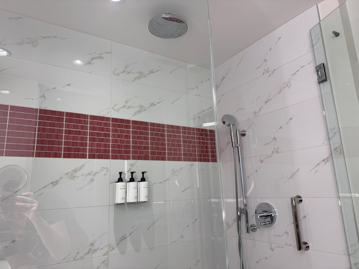 Conrad Las Vegas king room walk in shower with rain head and red tile
