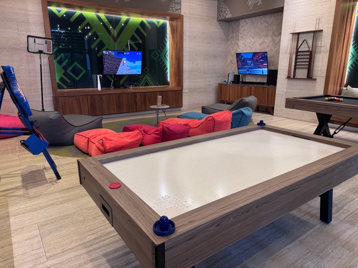 Conrad Tulum teen club air hockey gaming