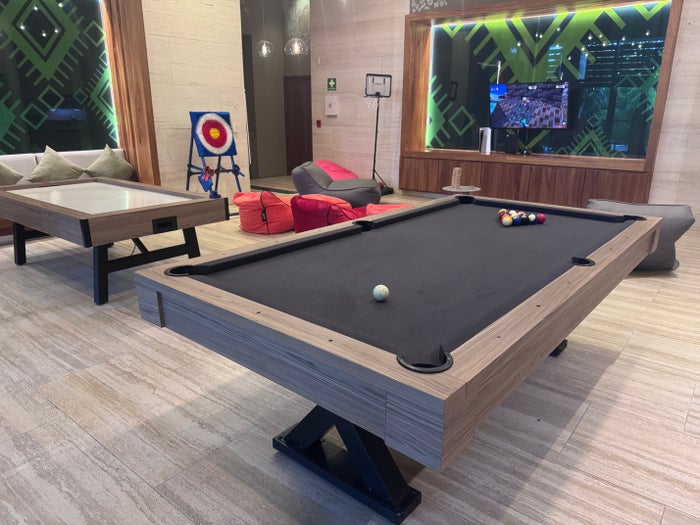 Conrad Tulum teen club axe throwing pool table
