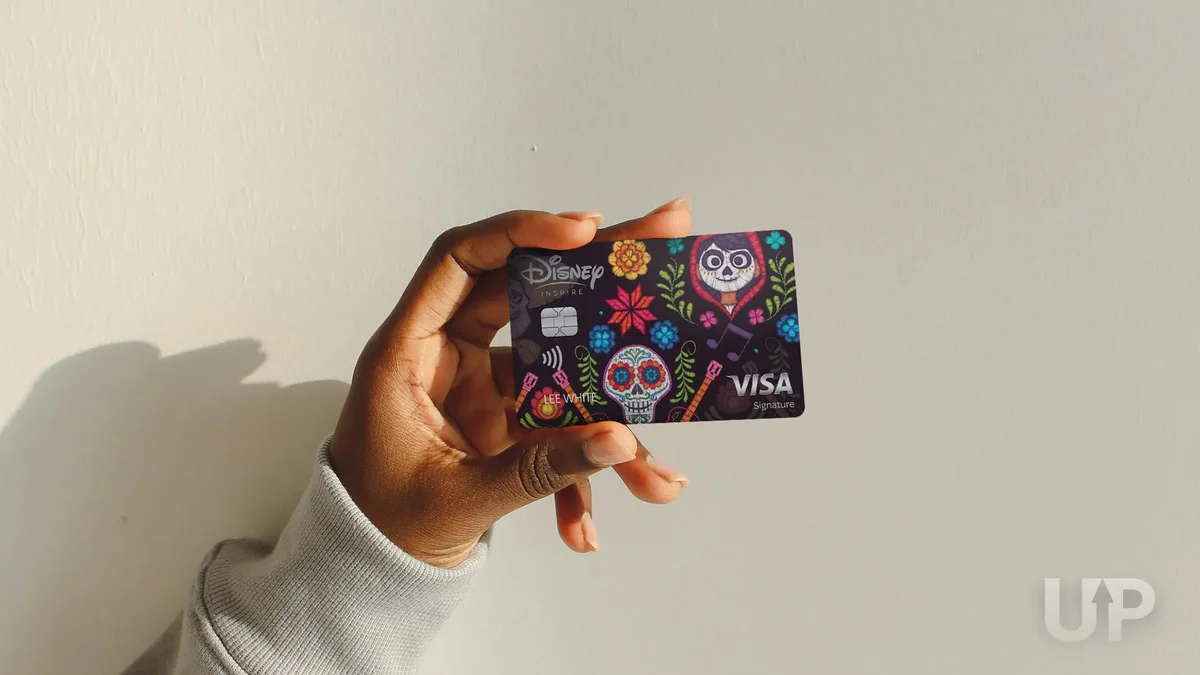 Disney Inspire Visa Card Coco hand