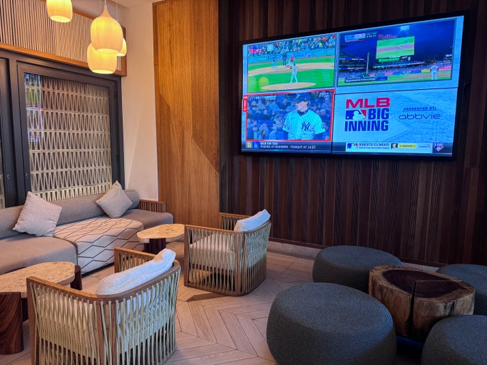 Hilton Tulum Azulinda Lobby Bar seating TVs