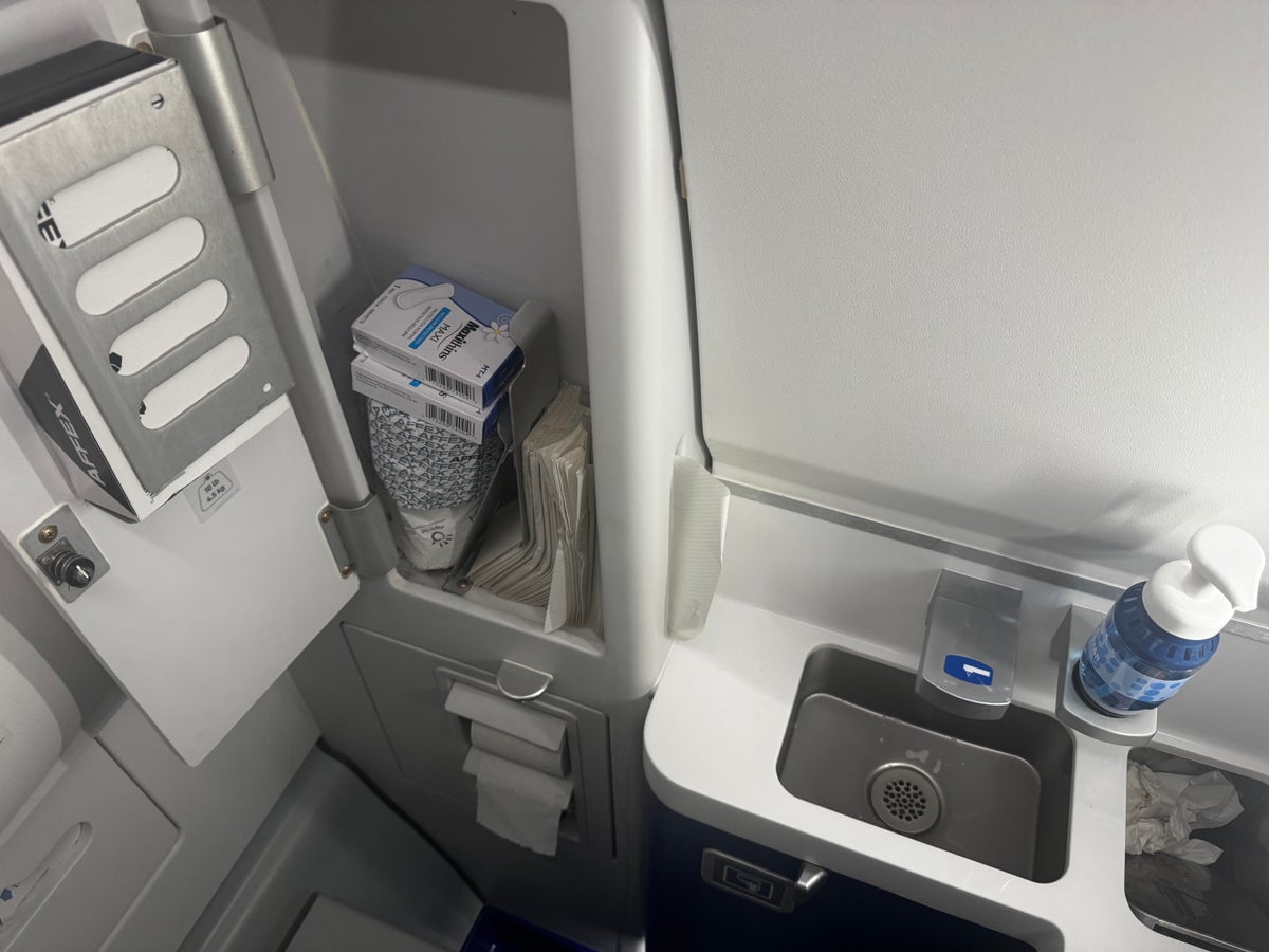 JetBlue A220 lavatory open cabinet