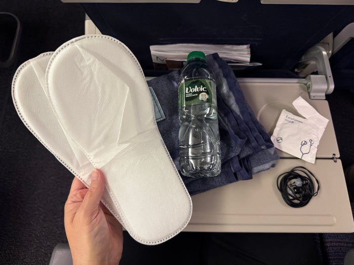 Korean Air B777 300 LHR ICN economy slippers blanket water earphones