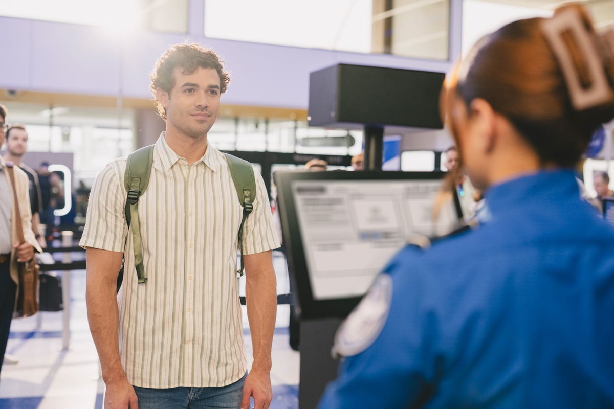 Large TSA PreCheck Touchless ID man officer closeup
