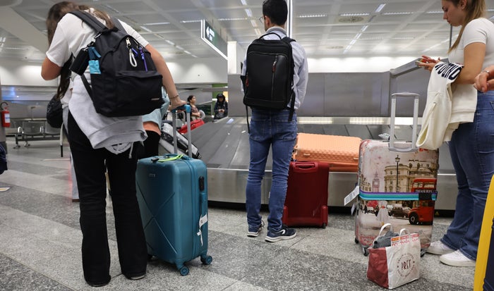 Passengers Collecting Checked Baggage Upgraded Points LLC