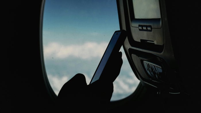 Phone airplane window closeup