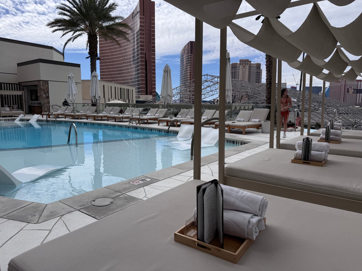 Resorts World Las Vegas Athena Infinity Pool daybed loungers with pool and Strip view
