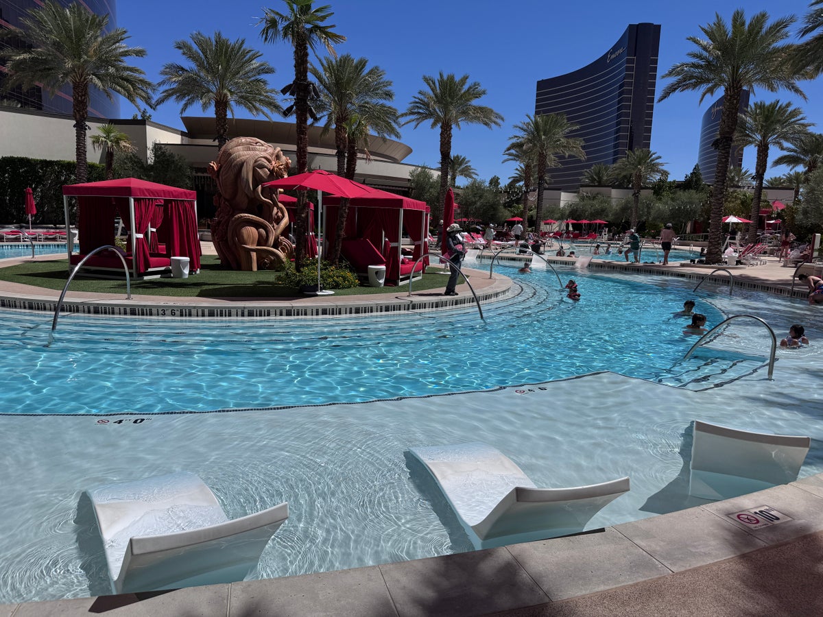 Resorts World Las Vegas pool main pool with island cabanas and dragon sculpture