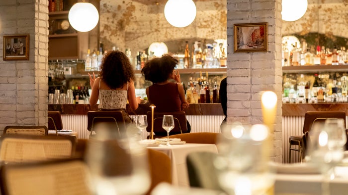 Resy restaurant dining room women at bar
