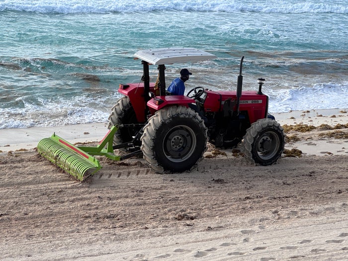 Secrets Mirabel Cancun Tractor Raking Beach Sand