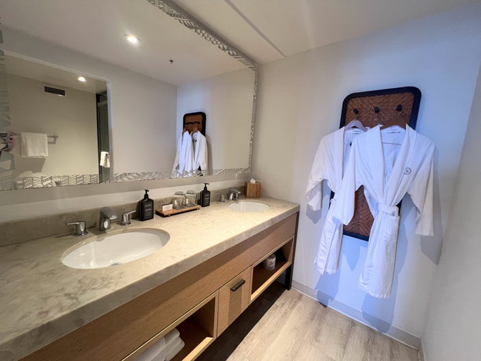 Sheraton Kauai Coconut Beach guest bathroom sinks and robes