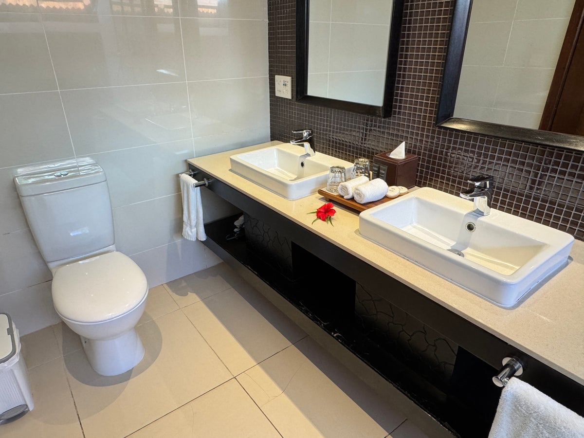 Sheraton Tokoriki Island Bathroom with double vanity sinks toilet hibiscus flower