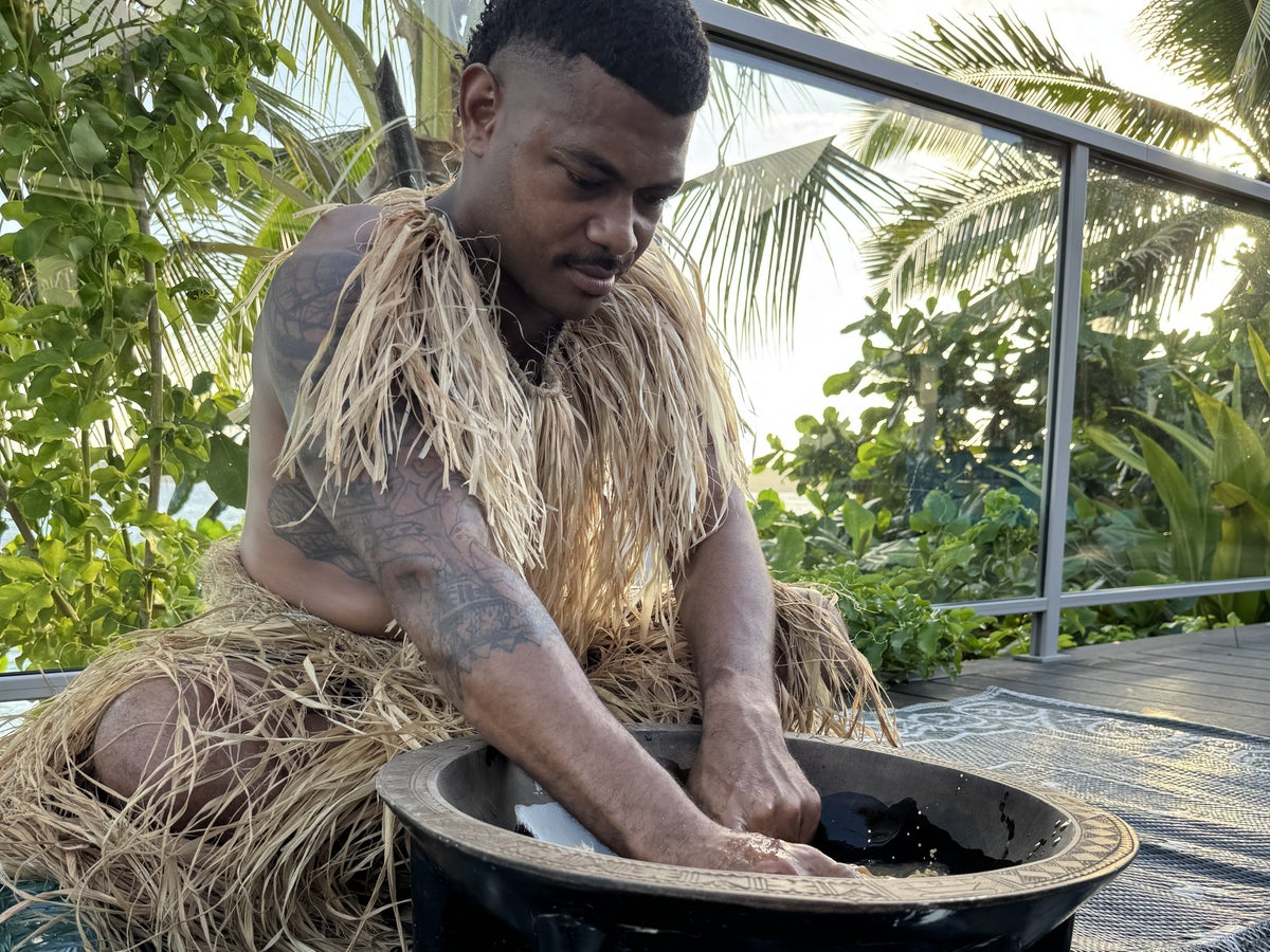 Sheraton Tokoriki Island Fijian man in traditional dress preparing kava ceremony