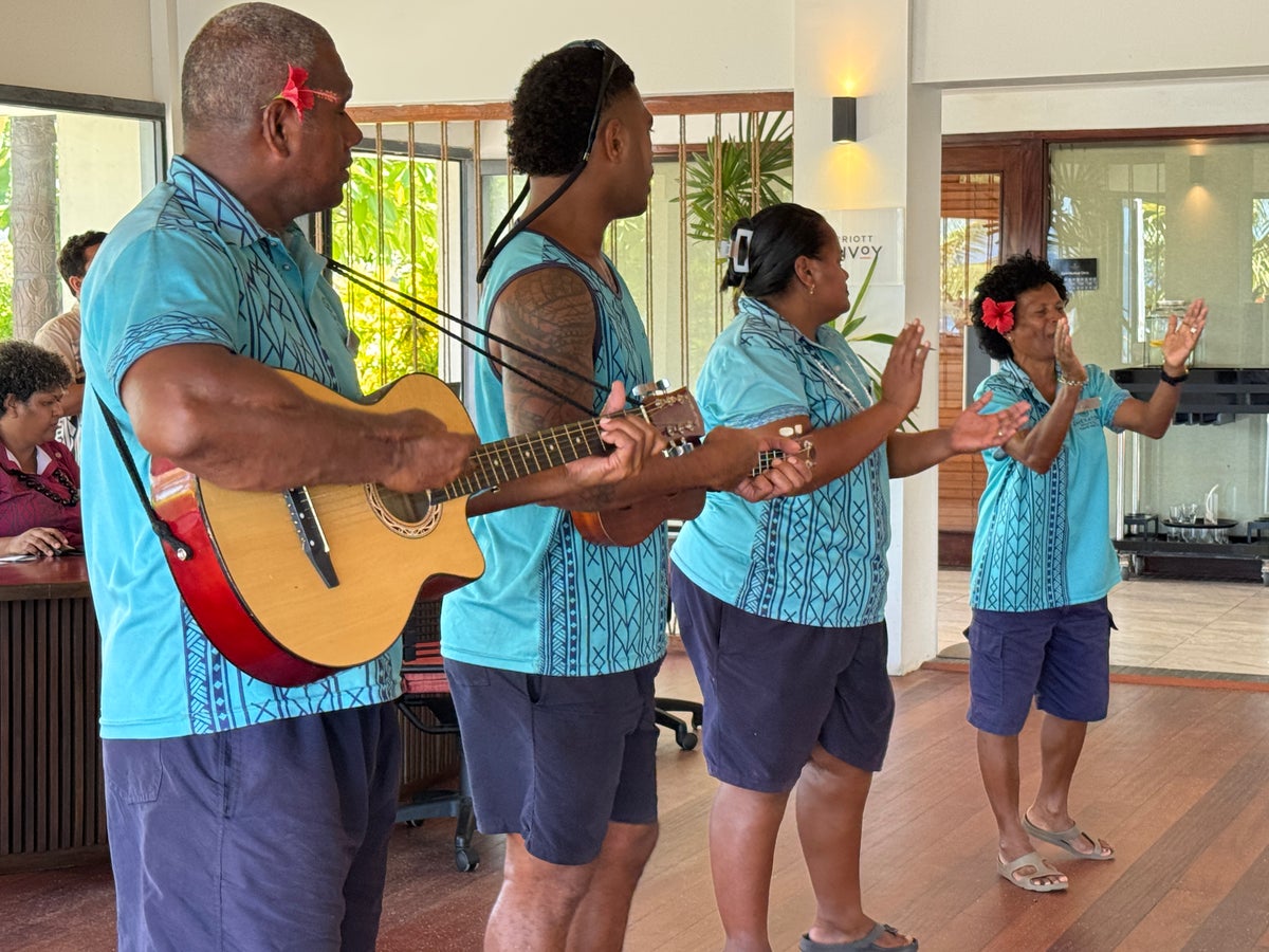 Sheraton Tokoriki Island Fijian staff performing traditional welcome song with guitar