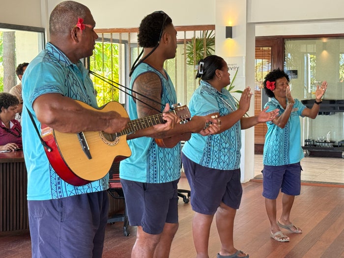 Sheraton Tokoriki Island Fijian staff performing traditional welcome song with guitar Sheraton Tokoriki Island Fijian staff performing traditional welcome song with guitar
