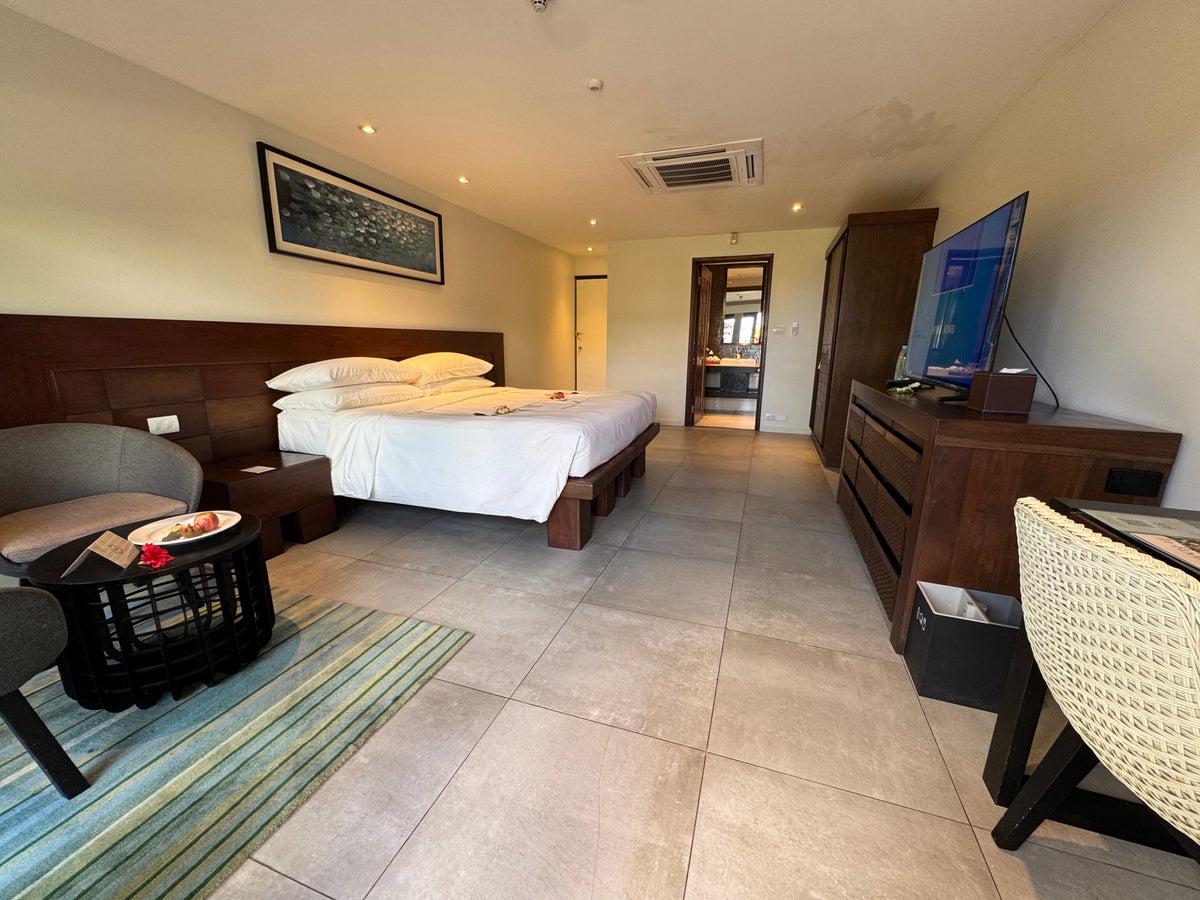 Sheraton Tokoriki Island Full guest room overview with bed TV en suite entry