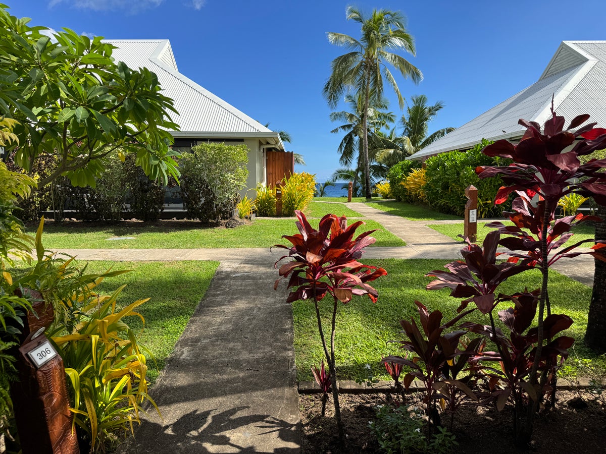Sheraton Tokoriki Island Garden pathway between bungalows with ocean glimpse