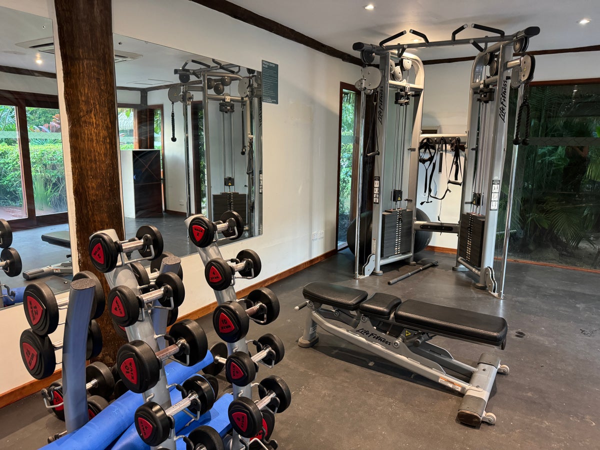 Sheraton Tokoriki Island Gym weight room with dumbbells cable machine bench