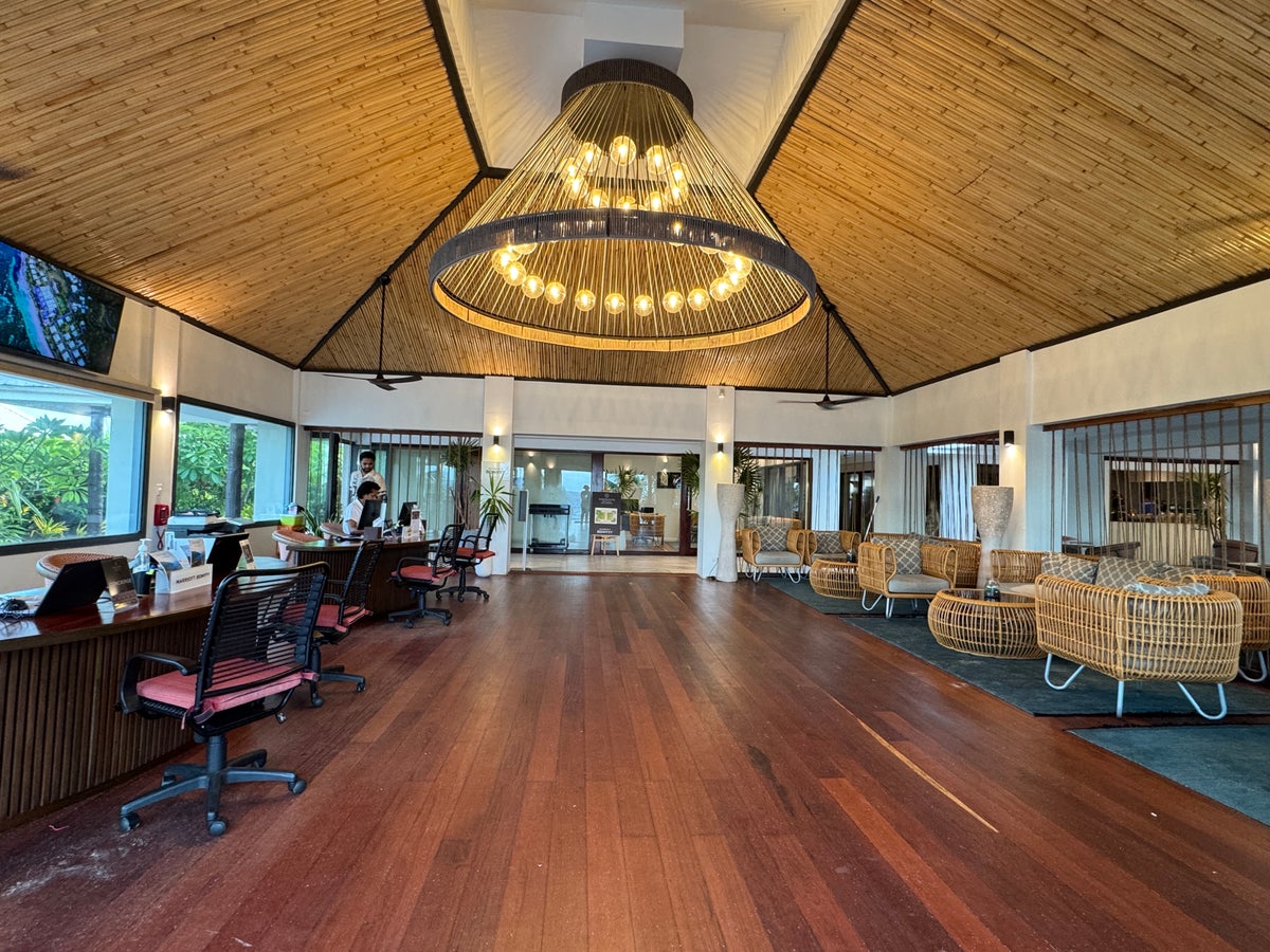 Sheraton Tokoriki Island Hotel reception lobby with chandelier check in desk seating