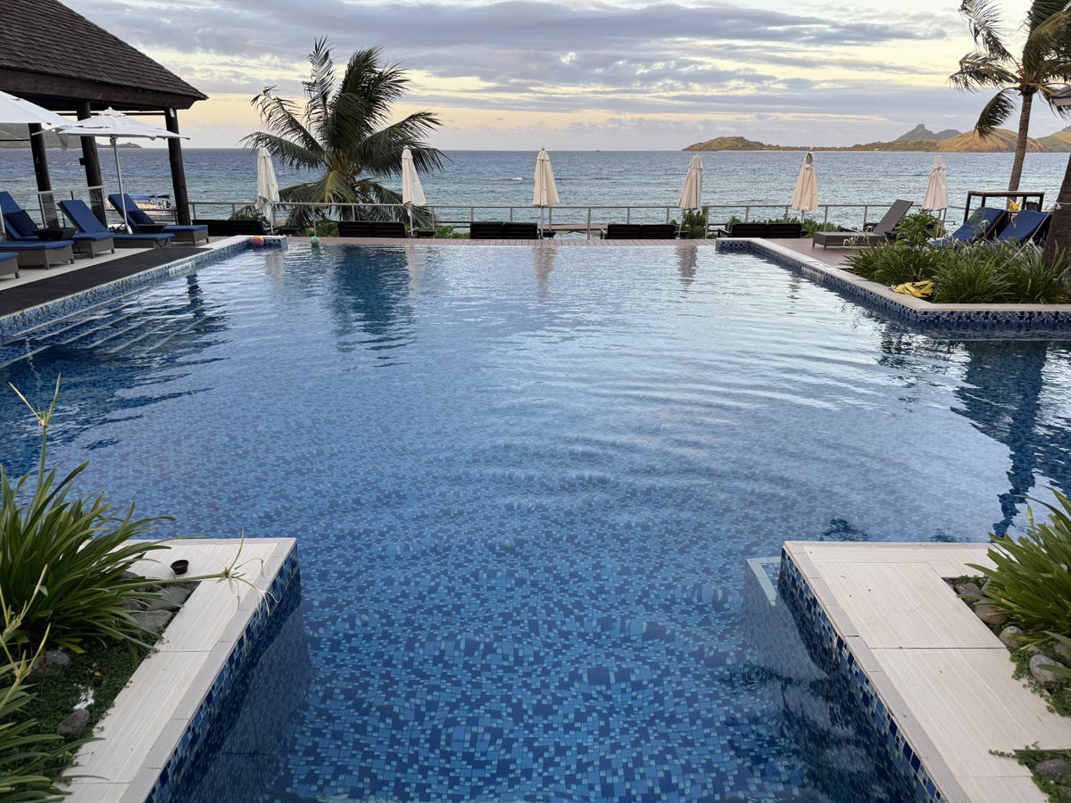 Sheraton Tokoriki Island Infinity pool dusk lounge chairs island views