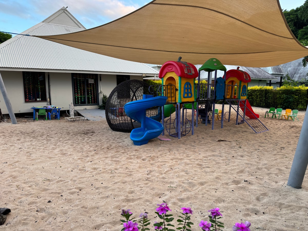 Sheraton Tokoriki Island Kids club playground with slide cubby houses in sand