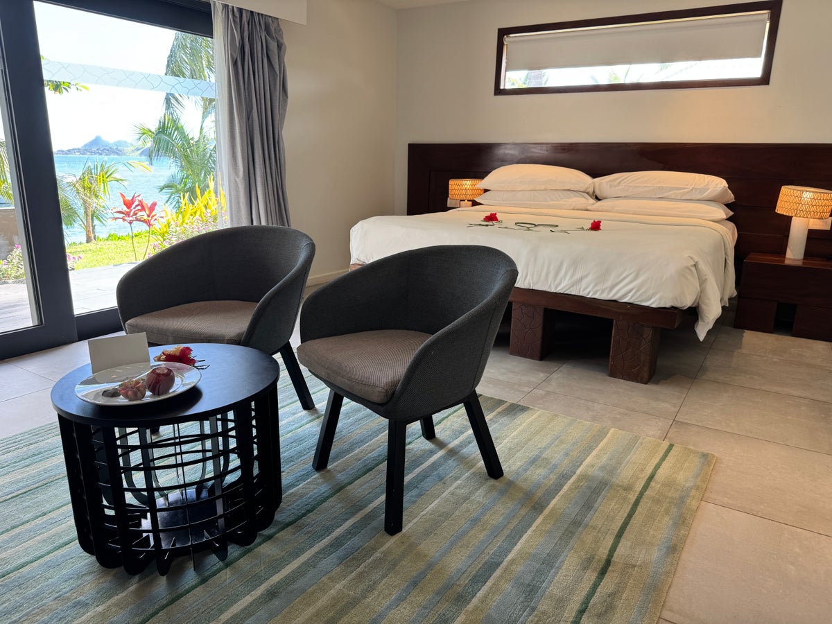Sheraton Tokoriki Island Ocean view room with king bed decorated with hibiscus flowers