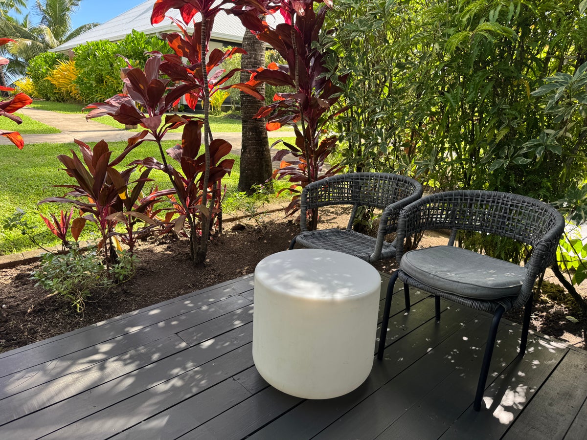 Sheraton Tokoriki Island Private outdoor deck with wicker chairs tropical garden