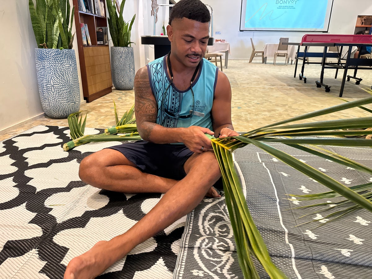 Sheraton Tokoriki Island Staff member demonstrating traditional Fijian palm leaf weaving