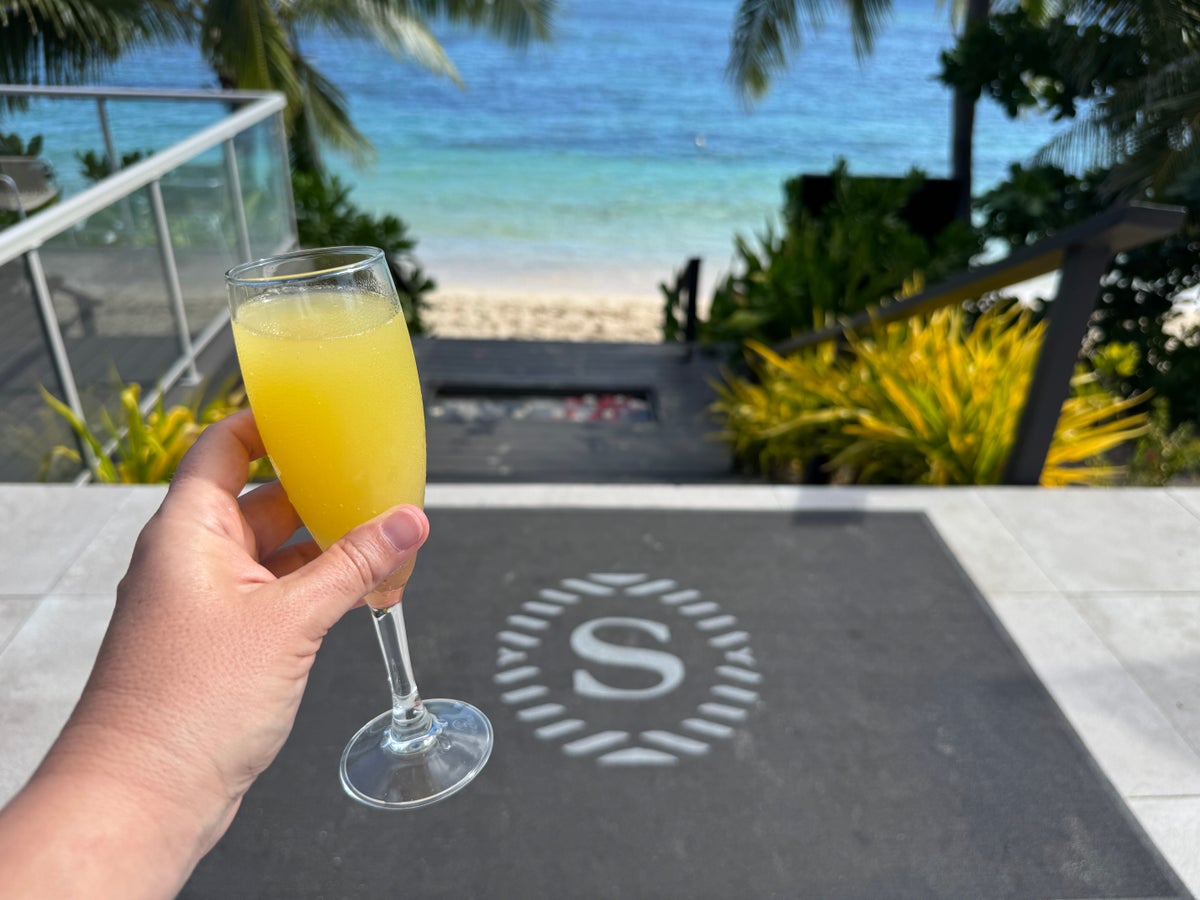 Sheraton Tokoriki Island Welcome mimosa with beach Sheraton logo mat