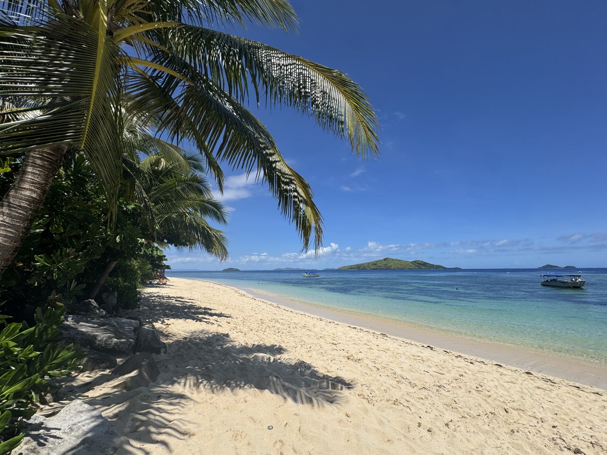 Sheraton Tokoriki Island White sand beach with palm trees ocean island views
