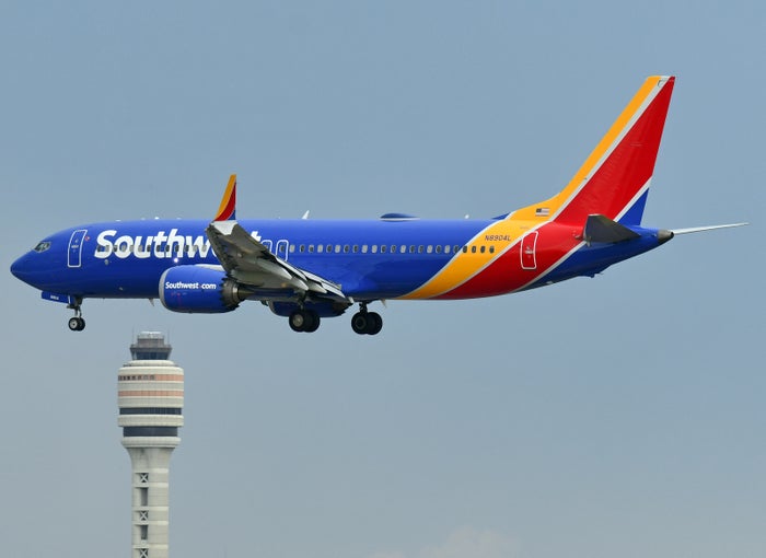 Southwest Airplane On An Airport Runway Southwest B737 Max 8 landing MCO tower