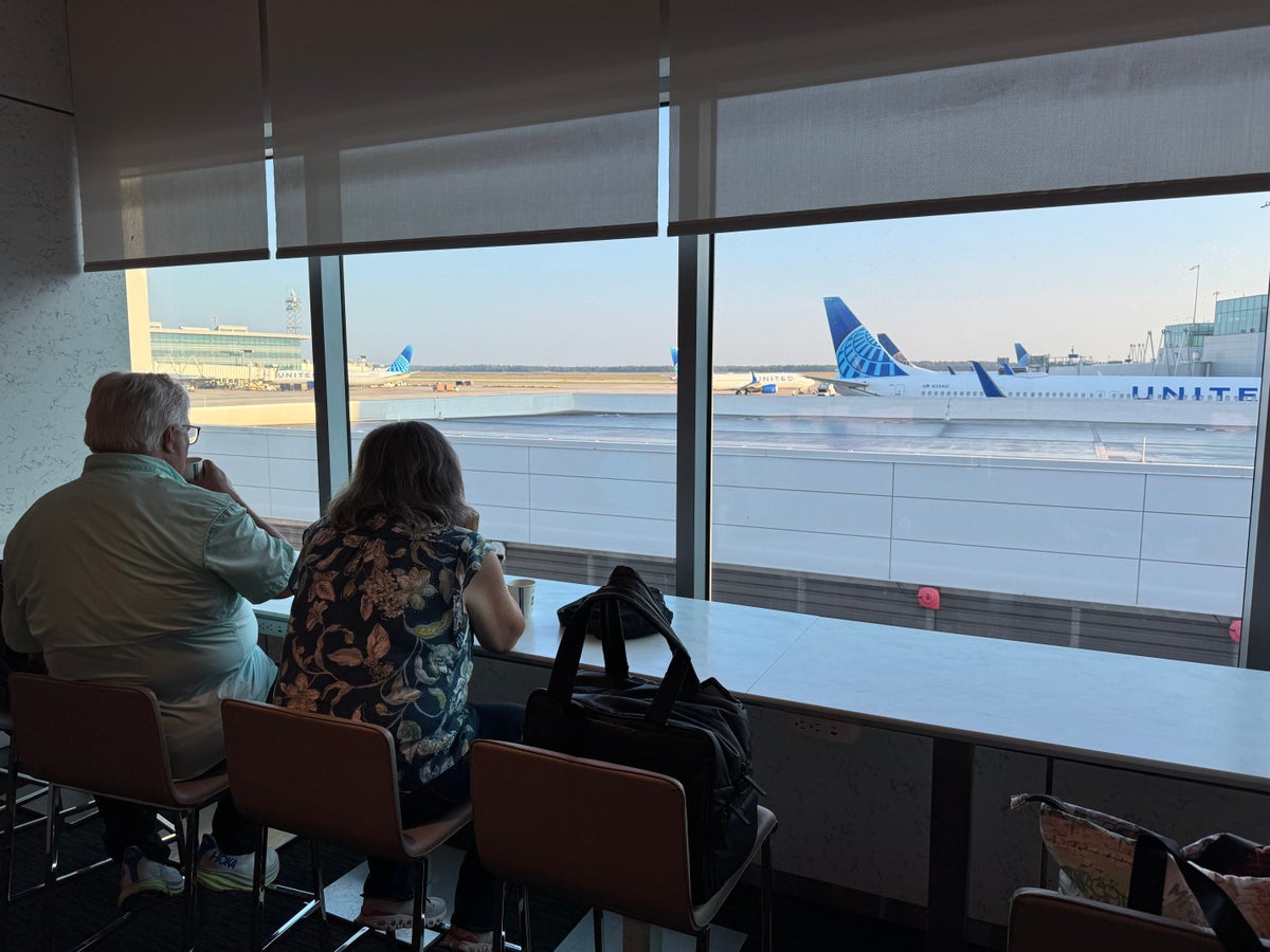 United Club IAH TC couple at window