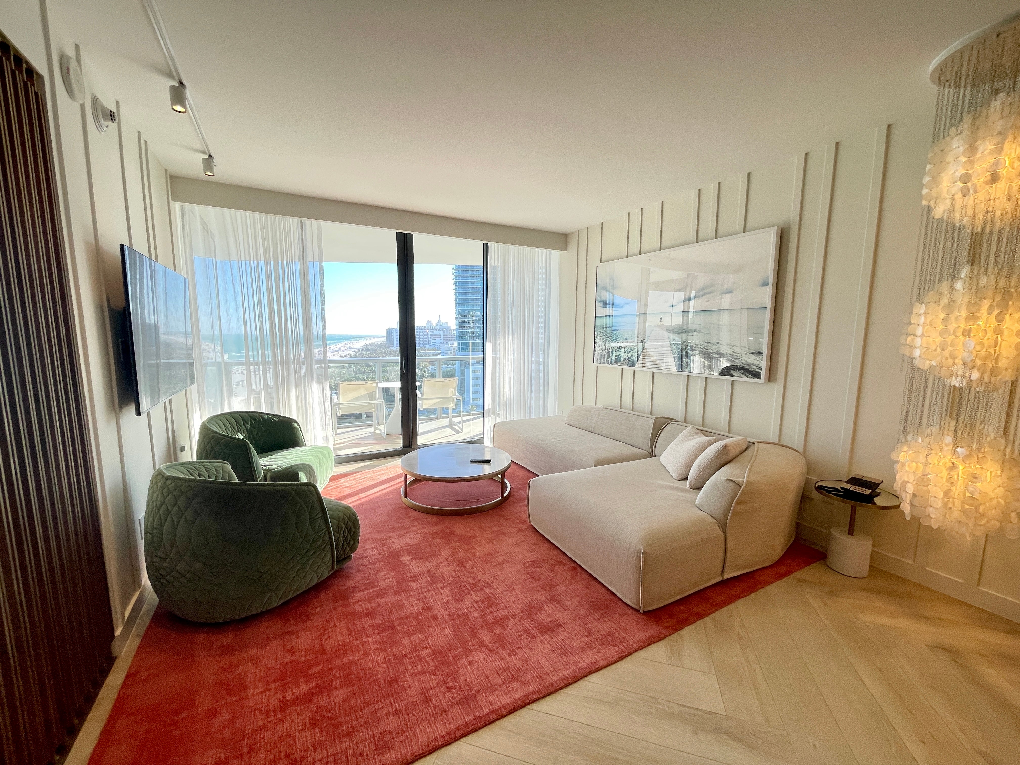 W South Beach suite interior with contemporary design and ocean views, before Waldorf Astoria renovation