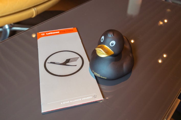 Lufthansa First Class terminal - boarding ticket and rubber duck