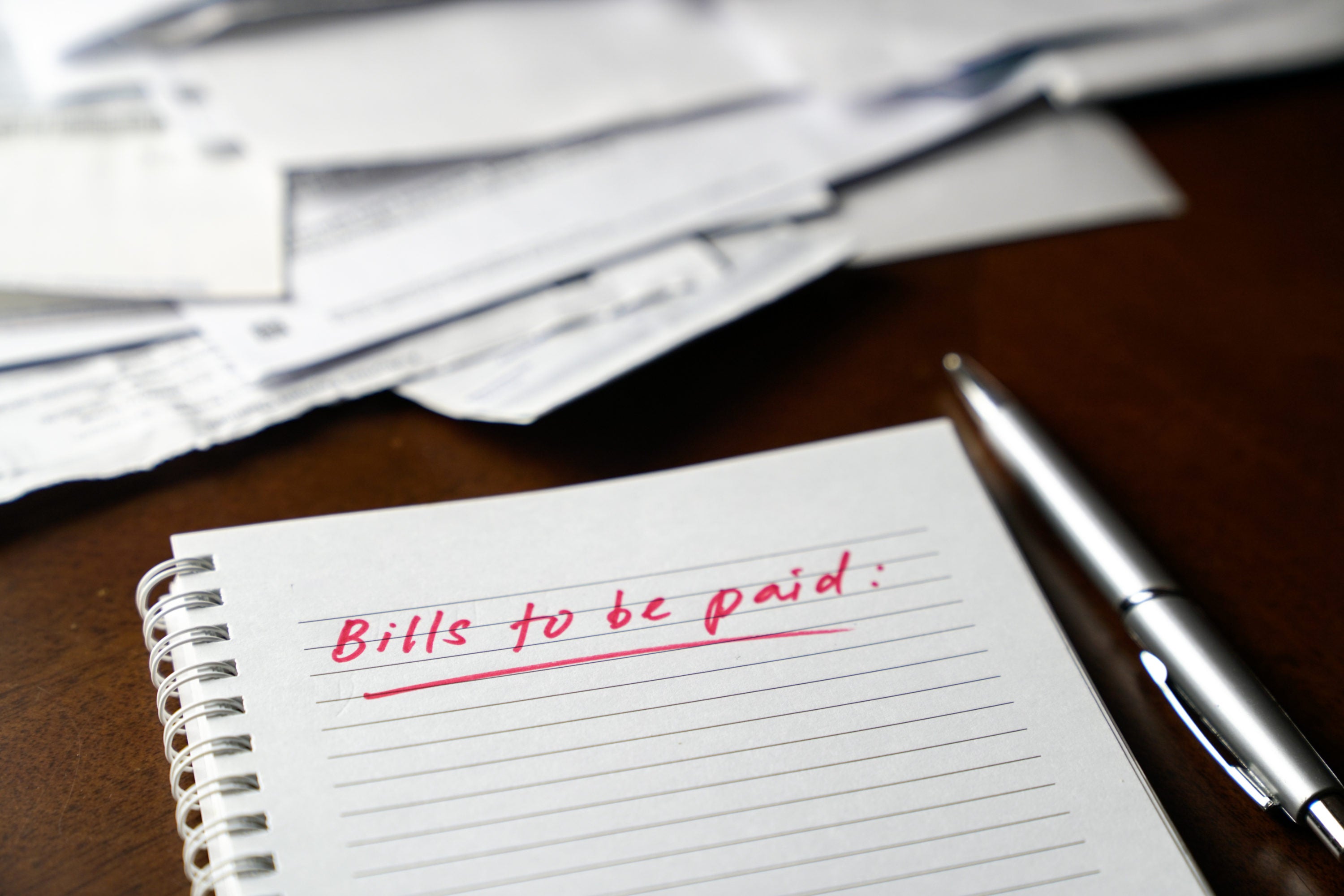 Bills to be paid written on notebook
